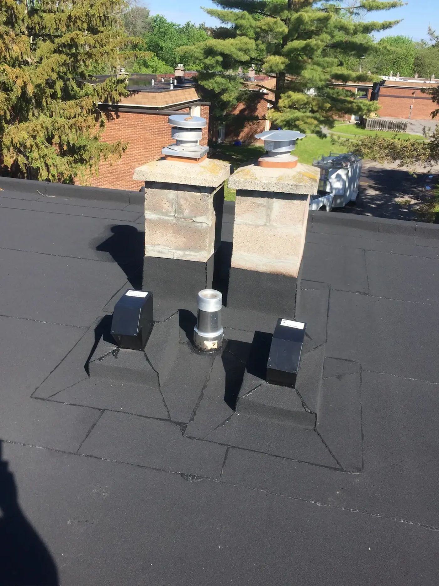 Fresh torch-down membrane on a flat commercial roof